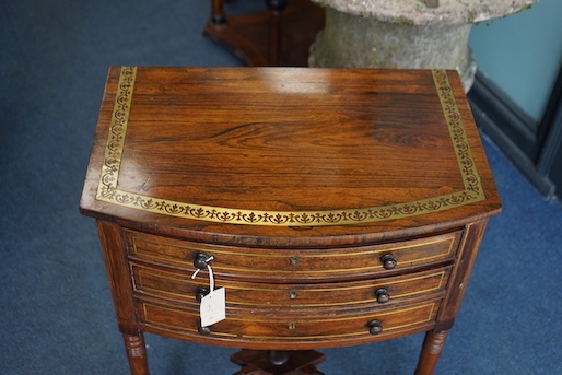 A Regency brass inlaid rosewood bowfront drop leaf work table, width 54cm, depth 36cm, height 70cm